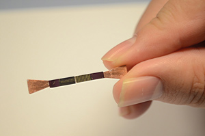 A new design for a compact on-chip laser showing the two tapered ends that allow light to be efficiently coupled with structures on the chip.